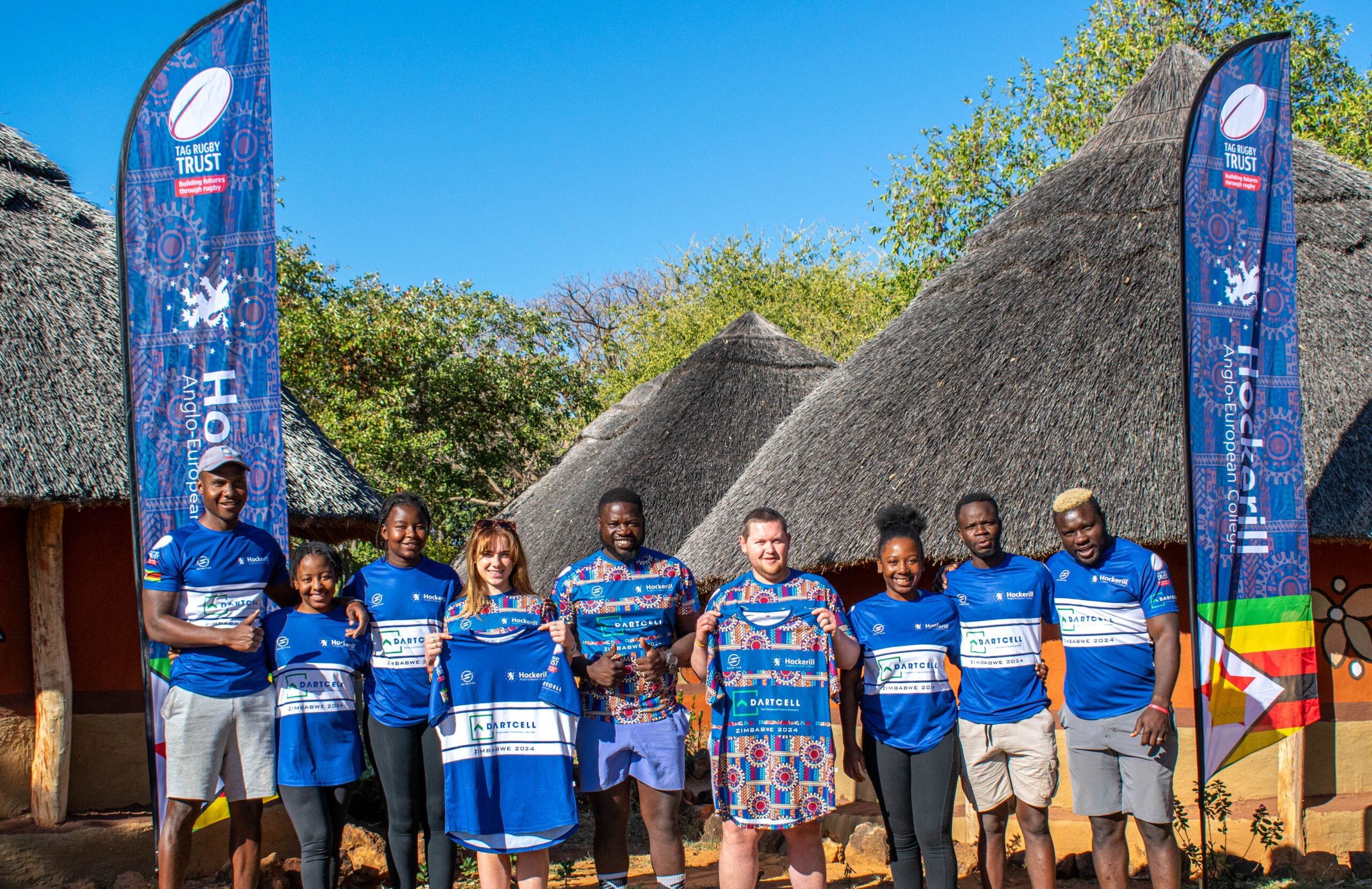 group shot of tour participants wearing Dartcell sponsored shirts